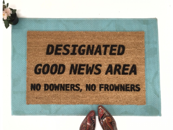 Designated Good News Area- no downers, no frowners! This funny doormat