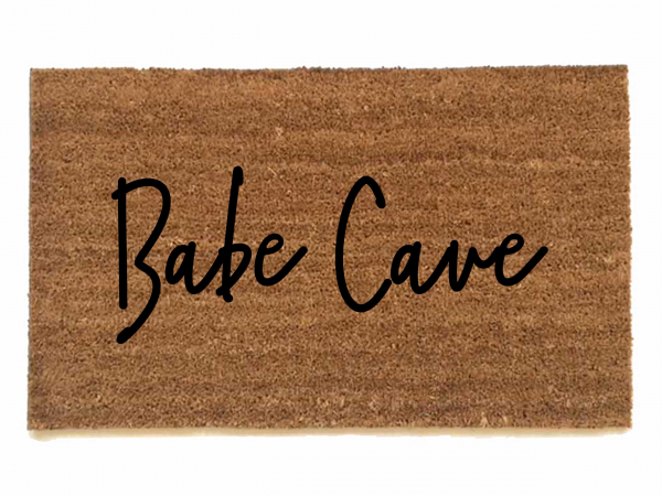 outdoor coir doormat reading "Babe Cave"