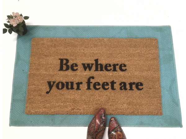 Be where your feet are mindful coconut coir doormat on a. blue layering rug