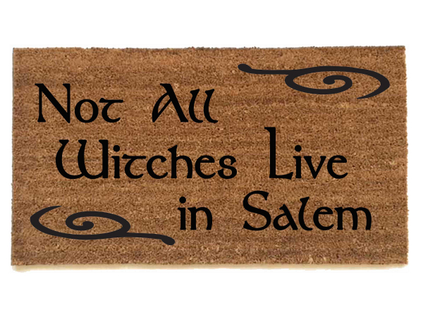 picture of a coir outdoor doormat reading "not all witches live in salem"