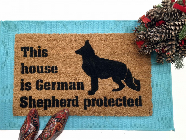 This house is German Shepard protected dog door mat