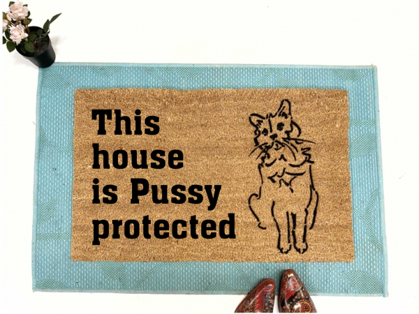 coir doormat reading This house is Pussy Protected with a drawing of a cat