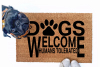 Dogs welcome, Humans tolerated doormat pictured with a silly black pug