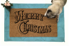 promo picture of a doormat reading Merry Christmas in old fashioned lettering
