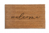 handwritten cursive welcome on a natural coir doormat