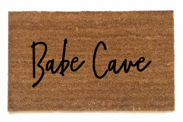 outdoor coir doormat reading "Babe Cave"