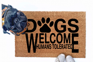 Dogs welcome, Humans tolerated doormat pictured with a silly black pug