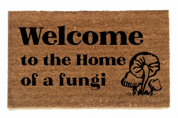 photo of outdoor coir doormat reading welcome to the home of a fungii mushrooms