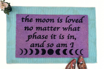 purple coir doormat with moon phase image and saying The moon is loved