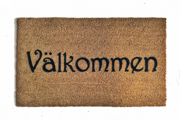 coir doormat reading "Valkommen!!" swedish for welcome