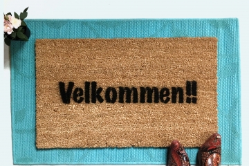 Velkommen!! It's Norwegian AND Danish for Welcome