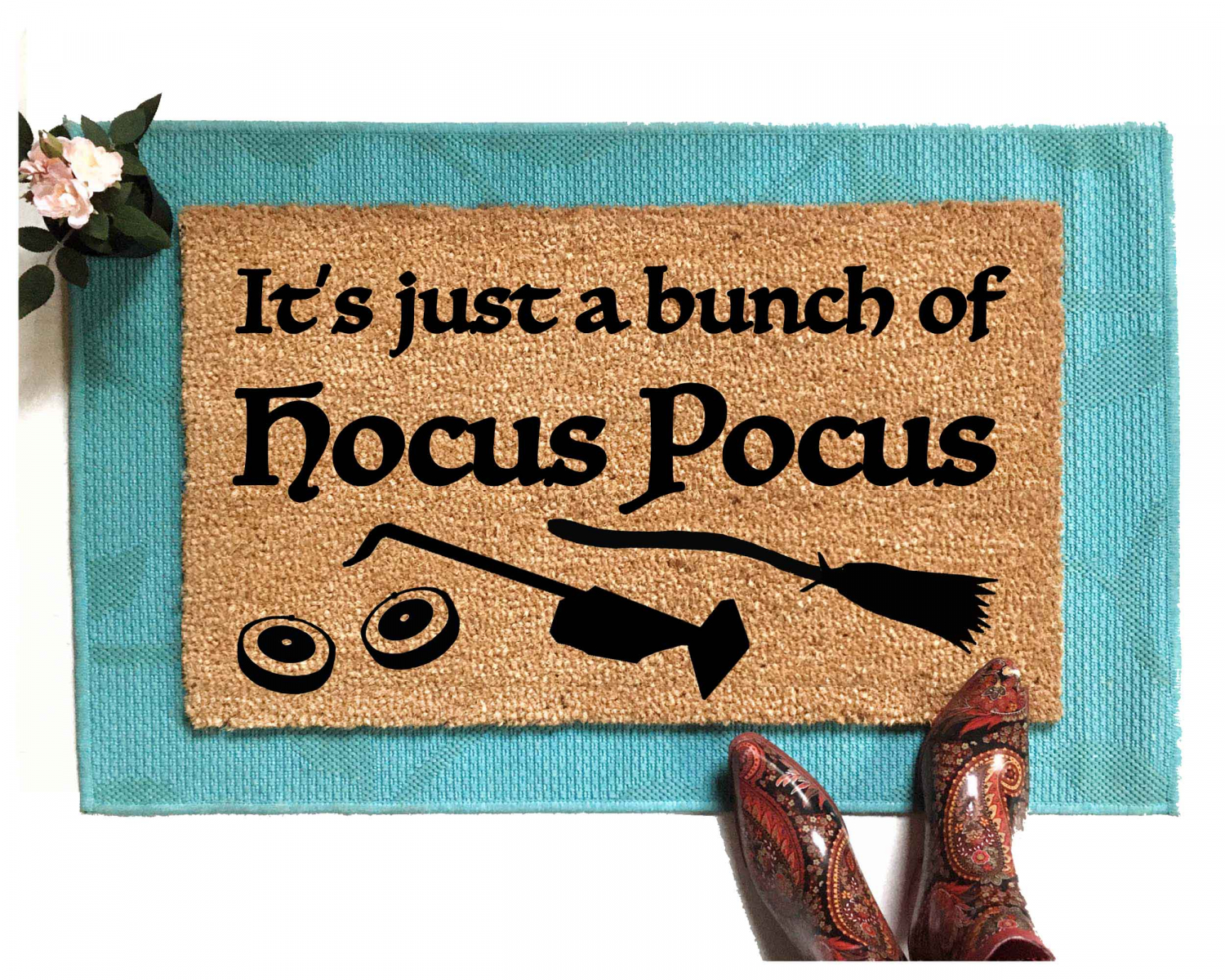 JUST A BUNCH OF HOCUS POCUS FUNNY HALLOWEEN DOORMAT pictured on blue layering rug with pumpkins and cute white shoes