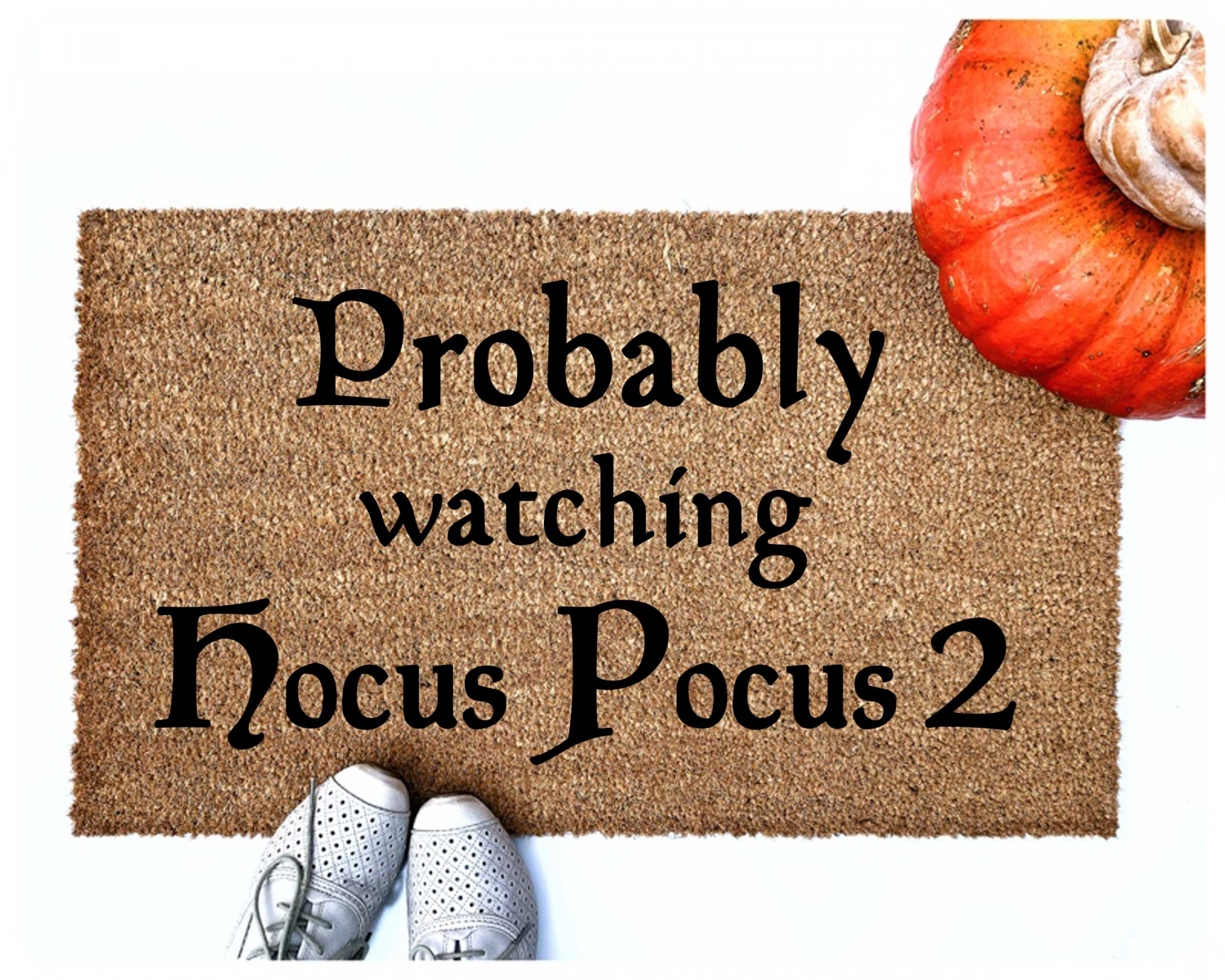 probably watchig hocus pocus 2 halloween doormat shown with pumpkins and cute white shoes