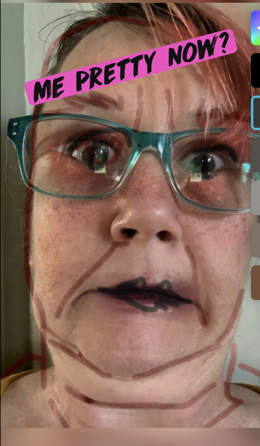 pink haired woman using fresh pineapple as a facial enzyme scrub making a zombie face