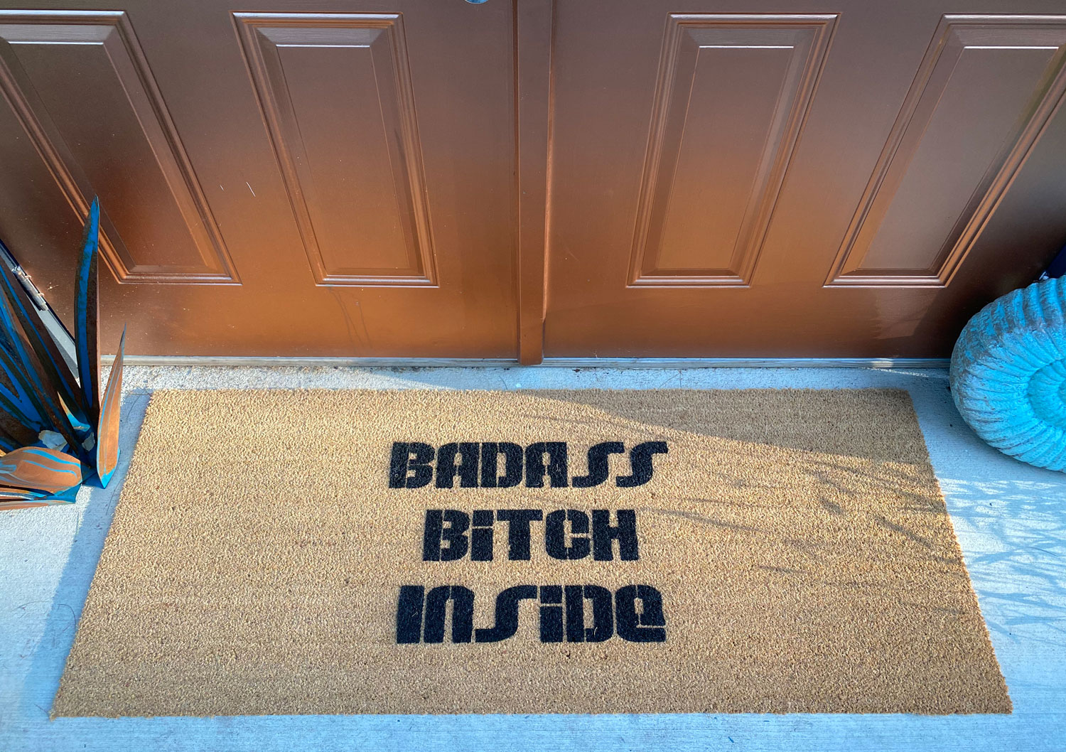 An oversized 24x60 rude doormat, showing how much bigger it reads at the door."