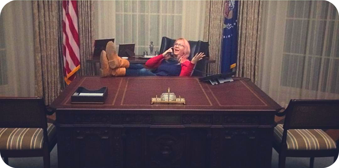 Damn good DOormats founder SPoon Popkin sitting at the Resolute Desk in The Oval Office