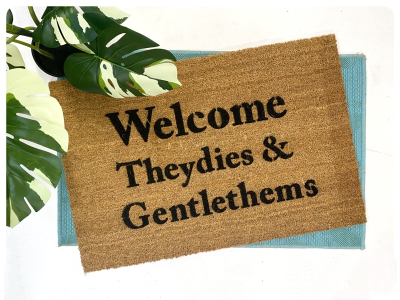 gay pride doormat reading Theydies and Gentlethems Welcome by Damn Good Doormats