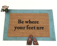 Be where your feet are mindful coconut coir doormat on a. blue layering rug