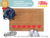 cute row of red hearts Valentine's Day doormat shown with a little black pug