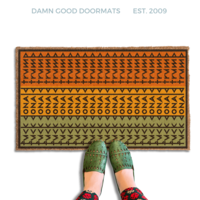 subtle fuck donald trump doormat in abstract contemporary design over pan african flag. 