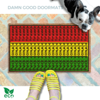 subtle fuck donald trump doormat in abstract contemporary design over the pan african flag with a french bulldog looking up