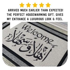 Gray all-weather welcome mat with black English and Arabic Ahlan Wa Sahlan bilingual lettering