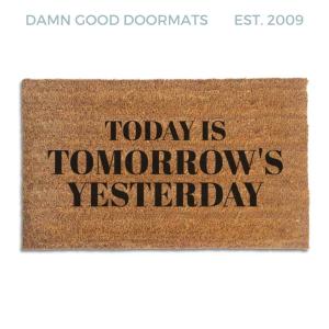 Coir doormat printed with Today Is Tomorrow's Yesterday in black serif capitals