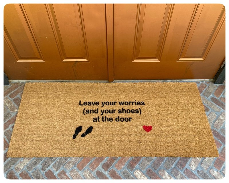 doublewide doormat reading "leave your worries and your shoes at the door
