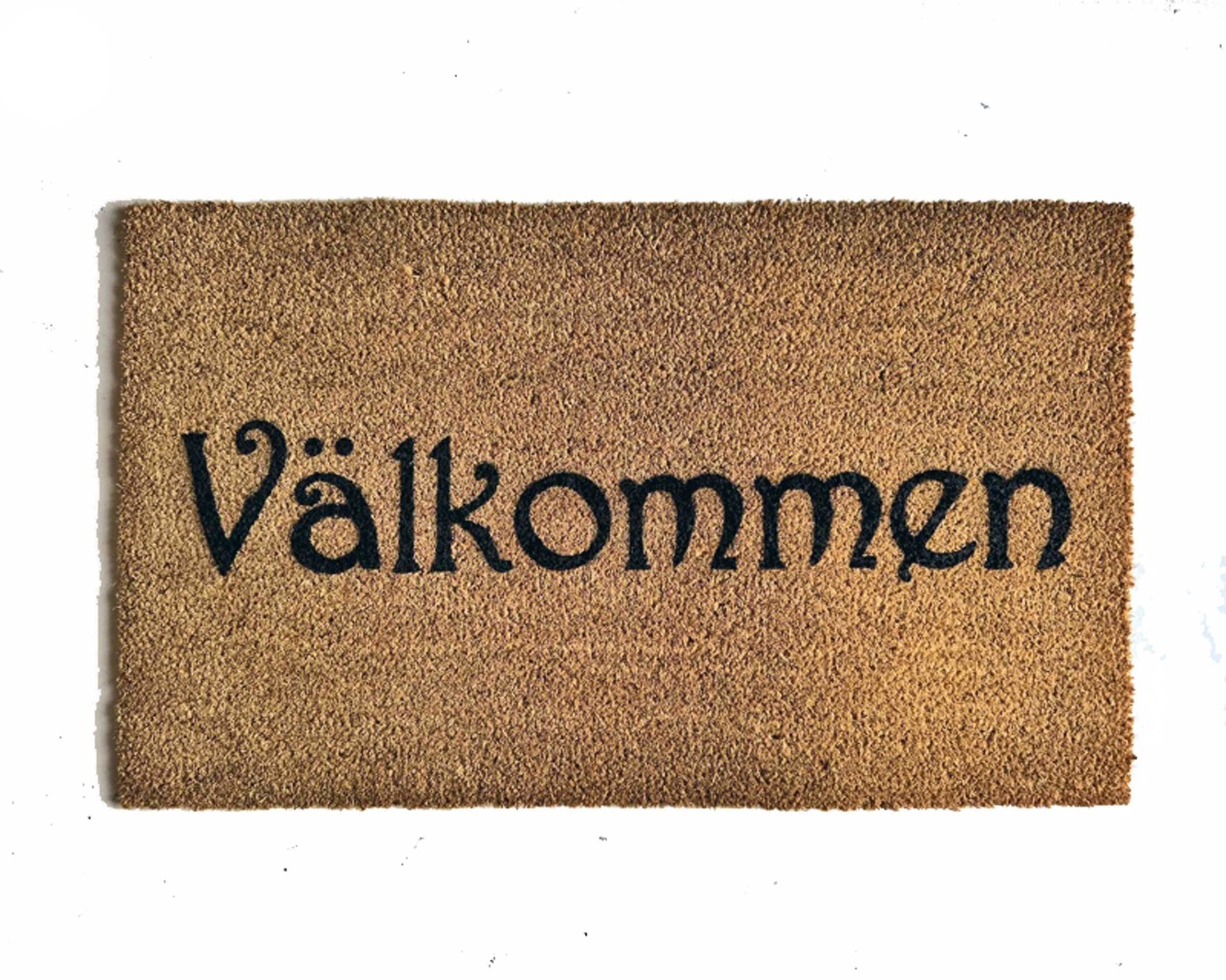 coir doormat reading "Valkommen!!" swedish for welcome