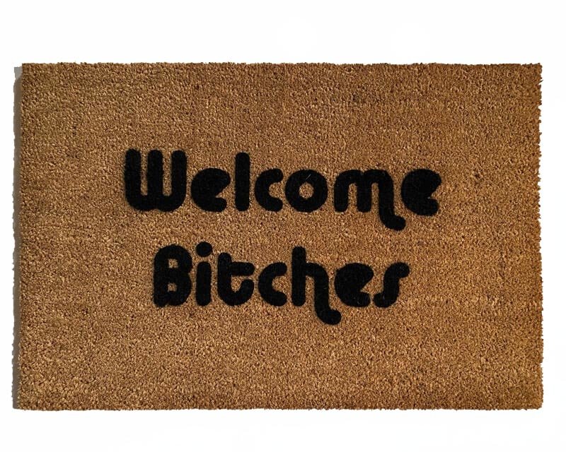 outdoor coir doormat with text "welcome bitches" on it