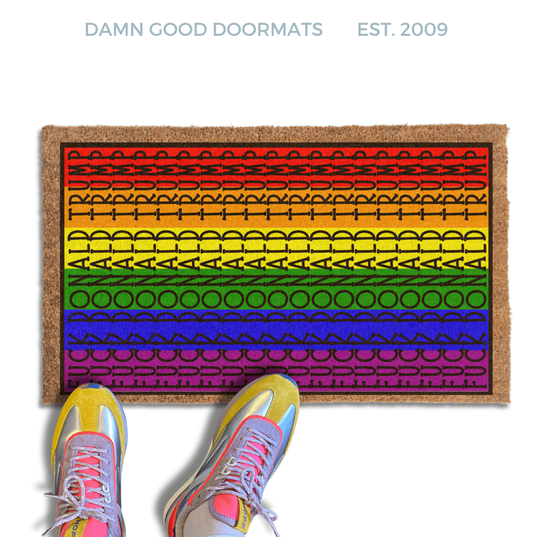 subtle fuck donald trump doormat in abstract contemporary design on a gay pride rainbow flag. 