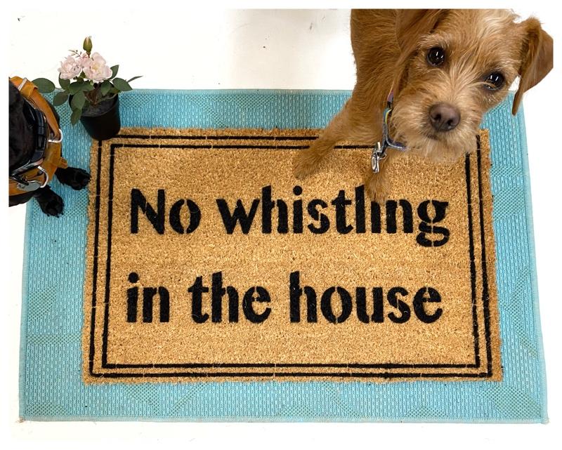 Coir welcome floor mat printed with No Whistling In The House, a Coraline-inspired doormat