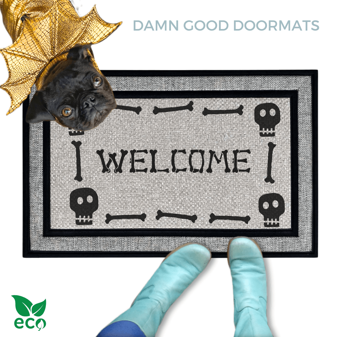 a black pug dog in a Halloween gold dragon costume welcome mat with the word "WELCOME", and a pair of feet wearing Smurf blue boots