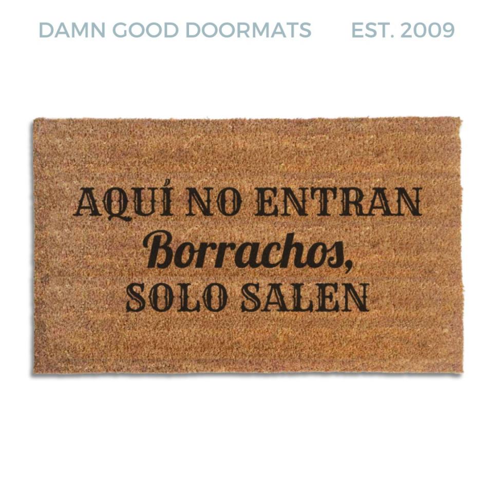 Coir doormat printed with Aquí No Entran Borrachos, Solo Salen in black cantina-style and script lettering