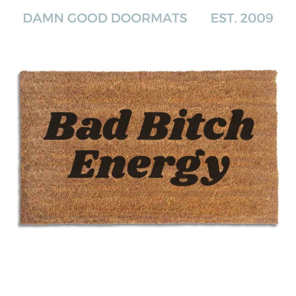 Coir doormat printed with Bad Bitch Energy in bold black italic slab lettering