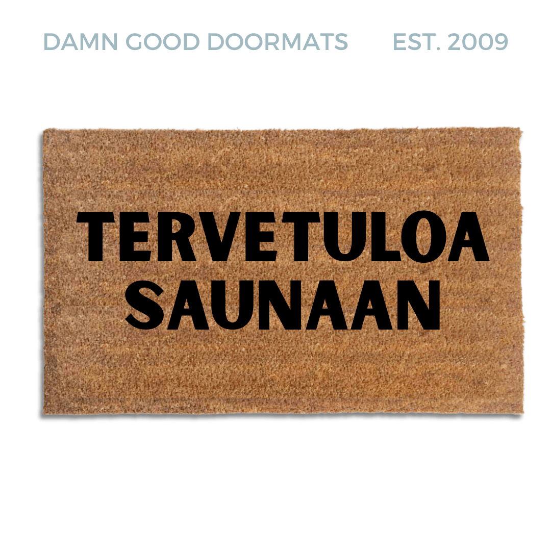 Natural coir doormat with black lettering reading tervetuloa saunaan, a Finnish sauna welcome mat