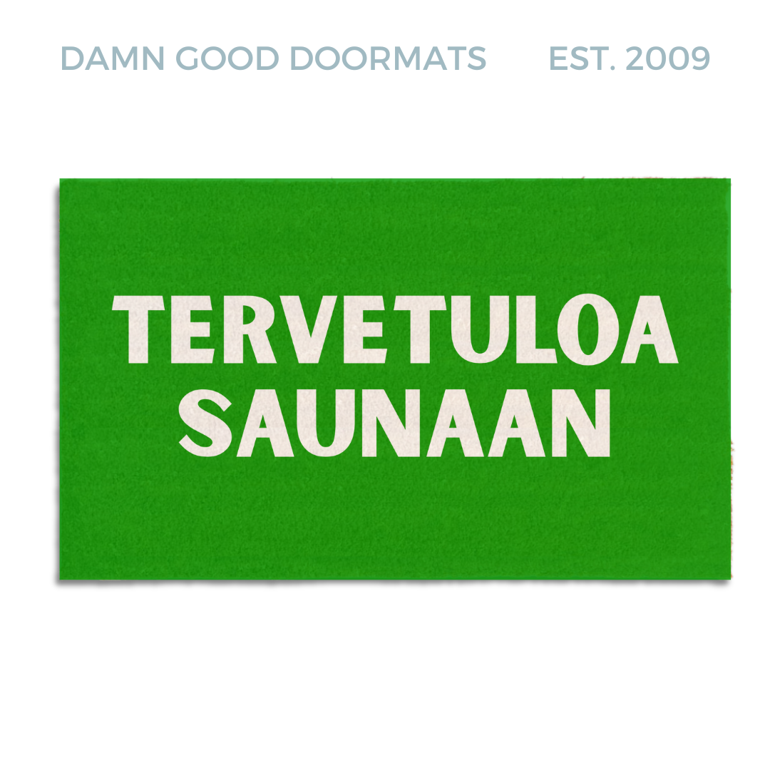 Natural coir Green doormat with white text reading tervetuloa saunaan, a Finnish sauna welcome mat