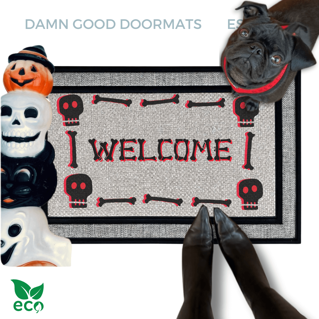 a Halloween-themed welcome mat with a skeleton and skull motif, a black pug looks up and a pair of feet in witchy boots stand on the doormat.