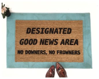 Designated Good News Area- no downers, no frowners! This funny doormat