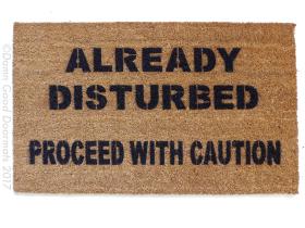 Coir Halloween doormat with 'Already disturbed, proceed with caution' text, funny welcome mat for front door