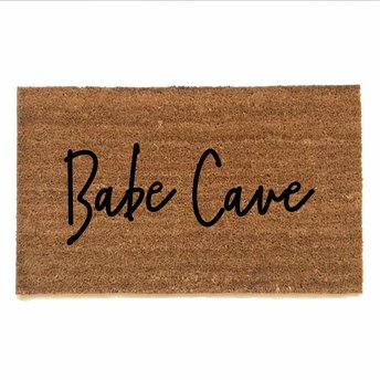 outdoor coir doormat reading "Babe Cave"