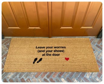 doublewide doormat reading "leave your worries and your shoes at the door