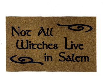 all weather doormat reading "not all witches live in salem in gothic lettering