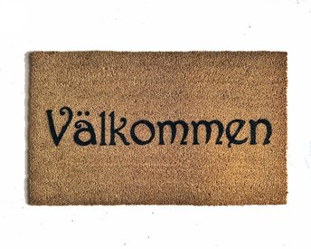 coir doormat reading "Valkommen!!" swedish for welcome