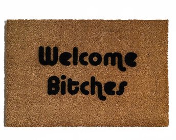 outdoor coir doormat with text "welcome bitches" on it