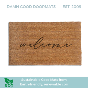 handwritten cursive welcome on a natural coir doormat