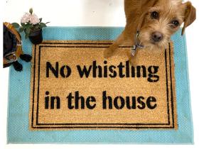 Coir welcome floor mat printed with No Whistling In The House, a Coraline-inspired doormat