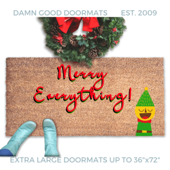 Merry Everything holiday doormat in red writing with a funny elf and blue boots