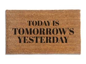Coir doormat printed with Today Is Tomorrow's Yesterday in black serif capitals