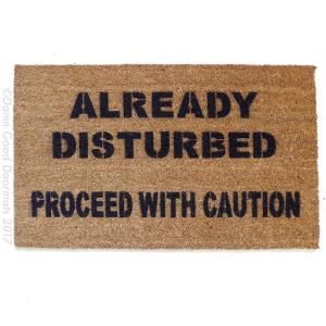 Coir Halloween doormat with 'Already disturbed, proceed with caution' text, funny welcome mat for front door